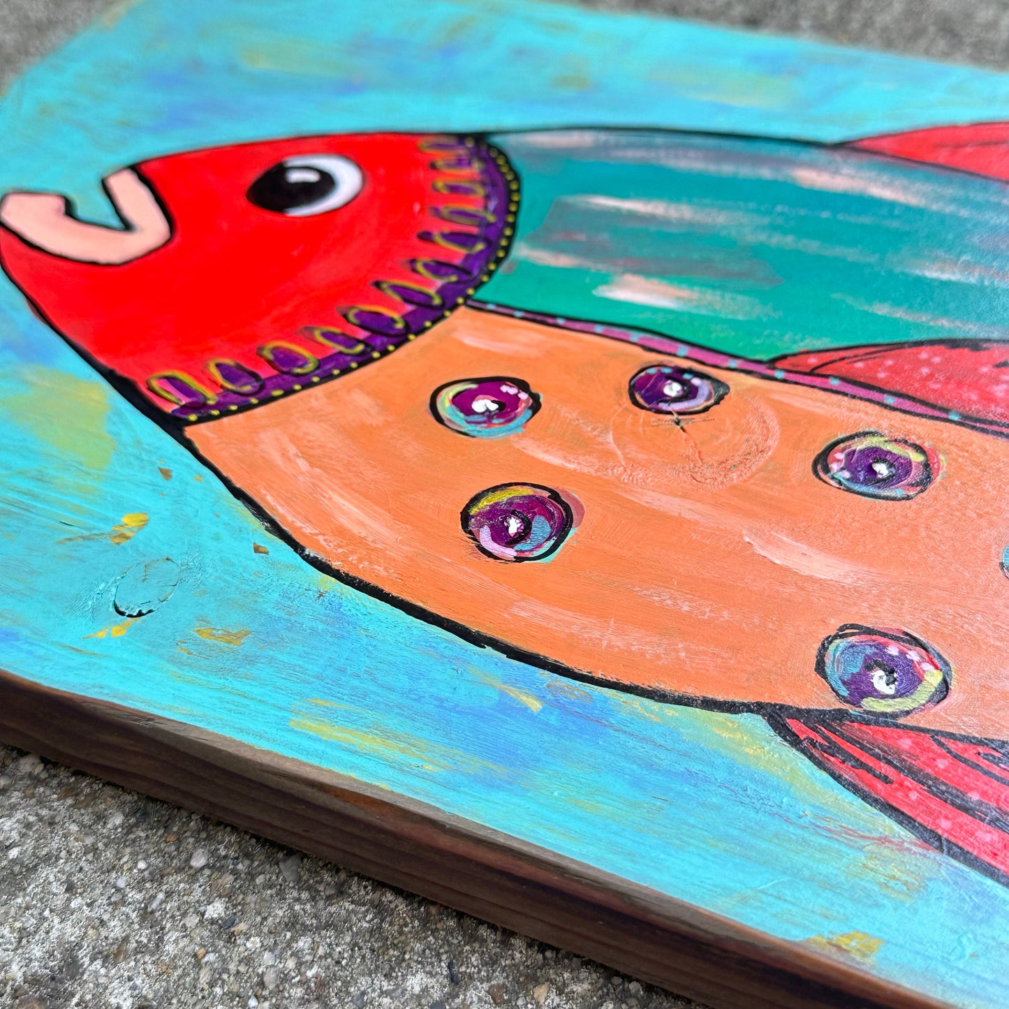 Stella-Painted fish on reclaimed hardwood, perfect for your lake life or coastal decor. Bright bold colors stand out on the stained wood.